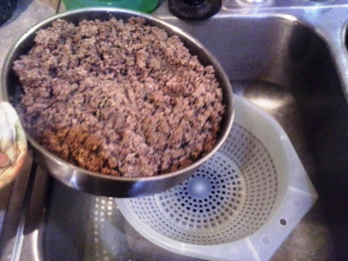 Step Ten: Turn off the heat on the stove and pour your hamburger meat into a strainer in the sink