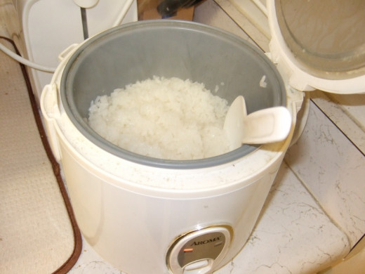 Fluffing up the rice.
