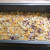 Transfer the mixture to a well greased loaf tin, cover with foil and place in the oven at gas mark 4. Transfer the mixture to a well greased loaf tin, cover with foil and place in the oven at gas mark 4.