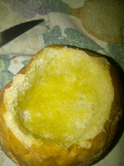 The bun's insides covered in olive oil.