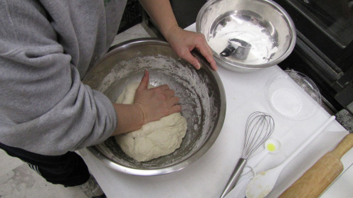 Get out the elbow grease and work the dough in the bowl to start - then transfer to a clean, flat, lightly floured surface.  This illustrates the size of the dough when I doubled the recipe.