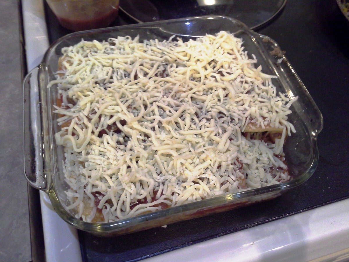 Step Twenty-two: Now cover the entire casserole with shredded cheese