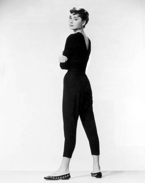 Audrey in cropped black pants, a slim black sweater, and cute ballet flats!
