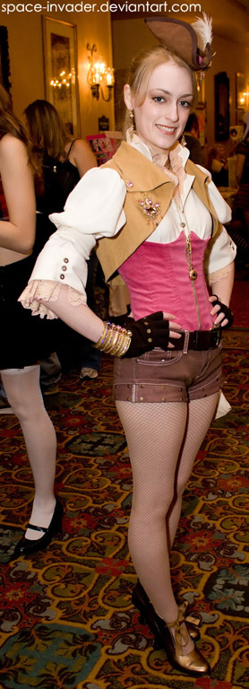 Here is a woman who has combined some brown khaki shorts and a regular belt (bought in any retail store) with a pink corset, a Victorian-style blouse and a bolero-style leather vest. The shoes, fingerless gloves and bracelets are retail available.