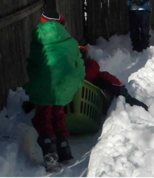 With snow on the ground, kids can race in a bobsled relay on a "track."