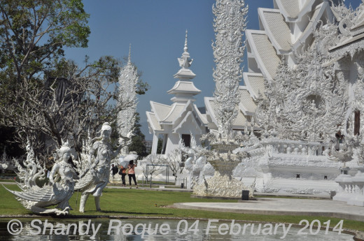 Eternal lovers by the pond.  Location: Wat Rong Khun (The White Temple)