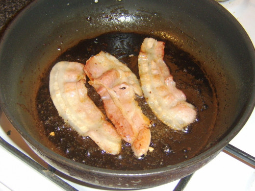 Frying bacon slices