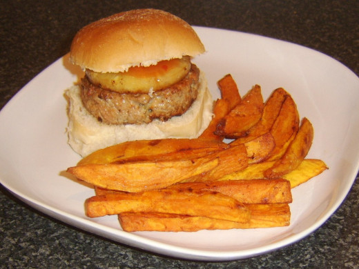 Sweet and sour sauce seasoned pork burger with pineapple and sweet potato fries