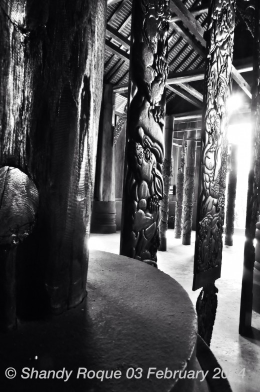 Intricately carved pillars of ghouls and demons line the interior of The Black House.