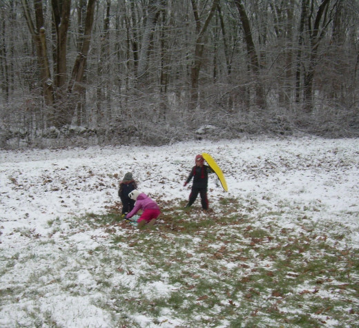 Children playing after a dusting of snow in late fall/early winter