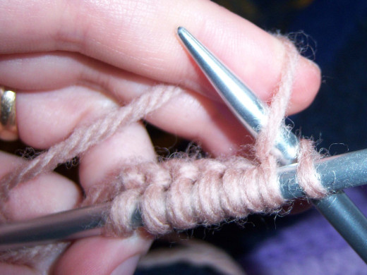 Loop the yarn over the needle tip.