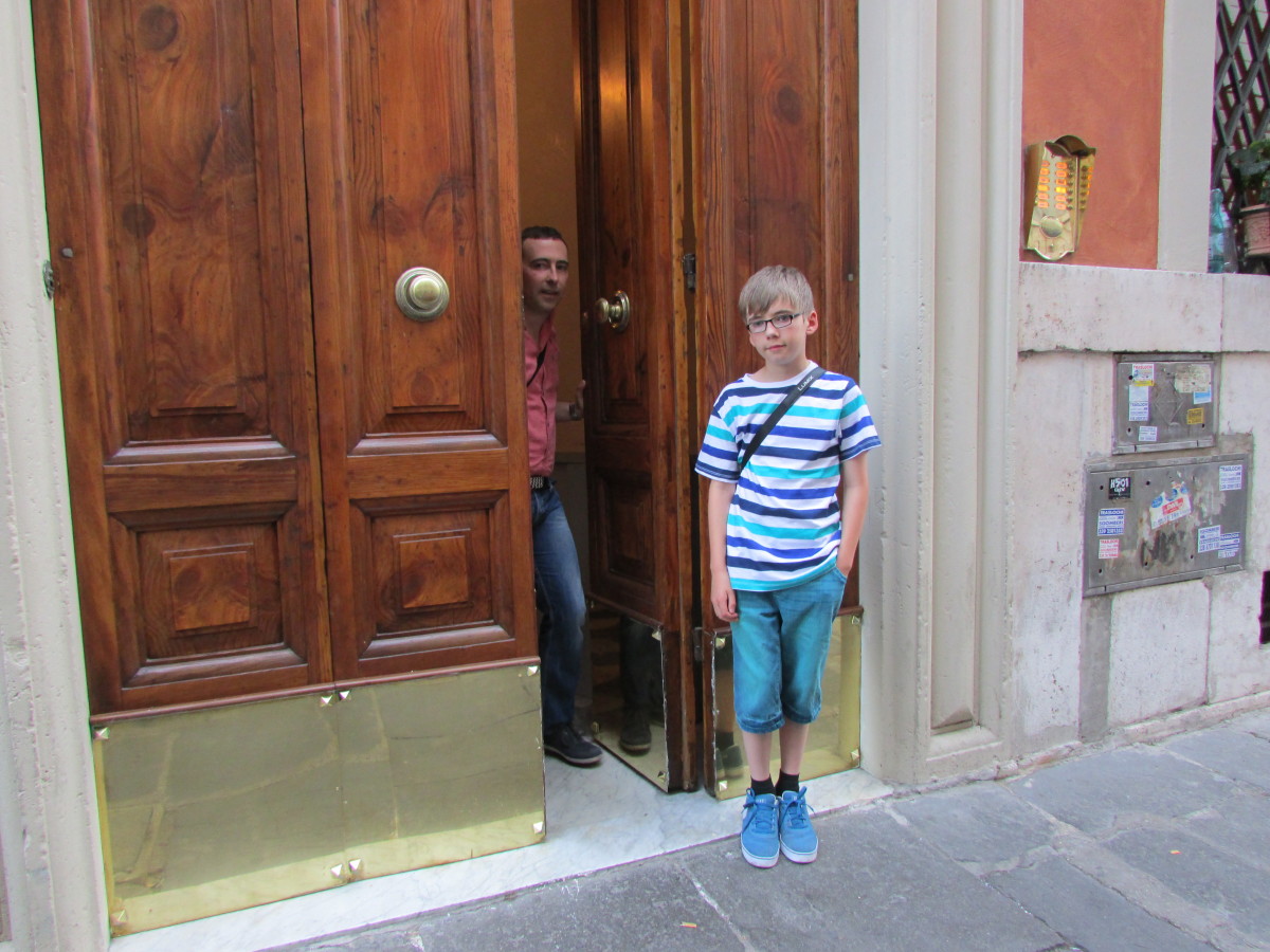 The huge door that leads to Residenza Dell'Angelo Apartments - well worth staying at, and you feel like a local