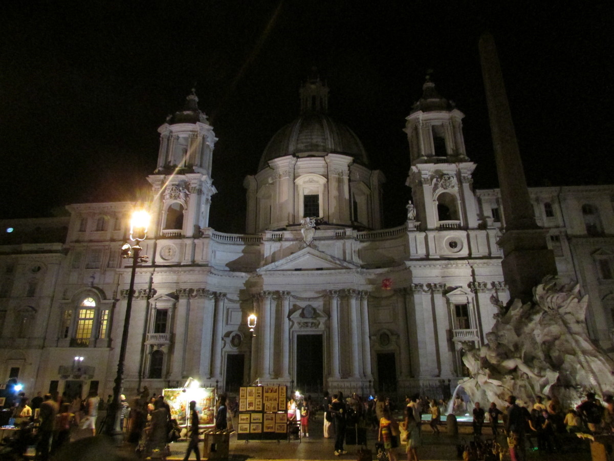 In Piazza Navona - the buildings are beautiful; tall and dominating.