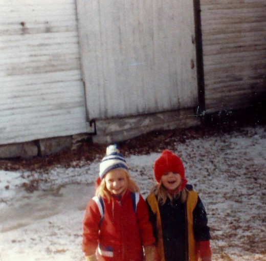 My sister and I in the snow before we moved to the new house