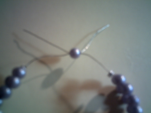 Finishing the bracelet.