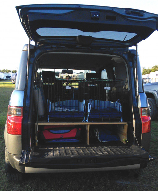 This is the back of my vehicle - with two crates permanently attached to a shelf I built for extra storage. 