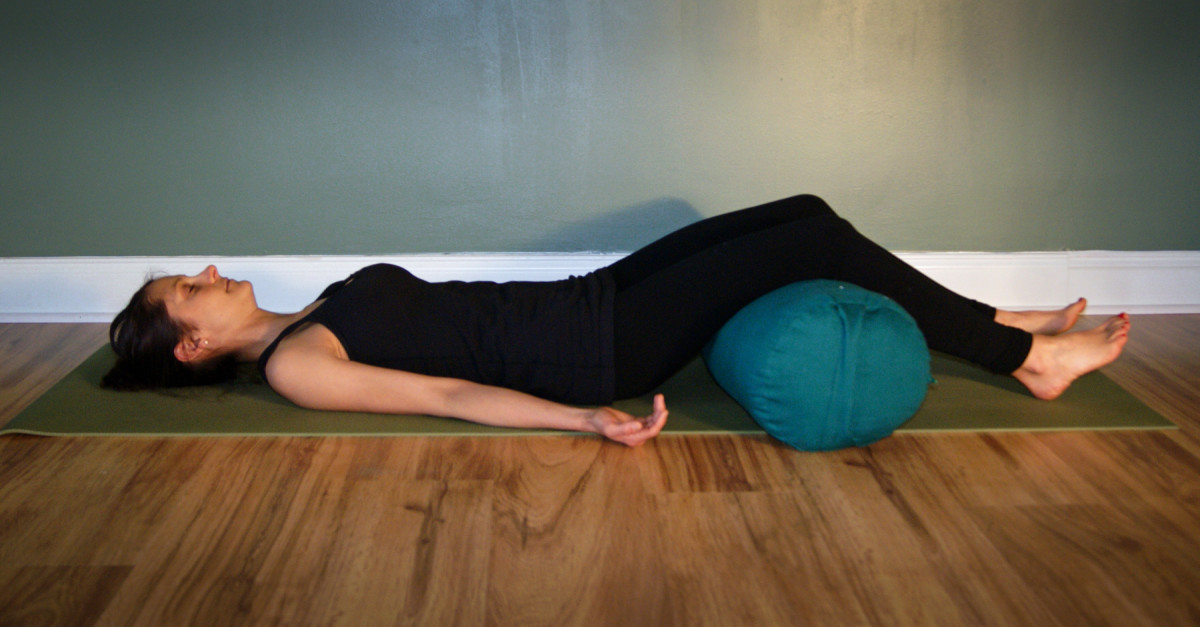 Savasana with a Bolster Under the Knees for Low Back Pain Relief