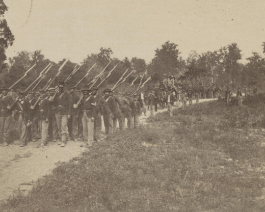 Troops pose while in a march by the flank