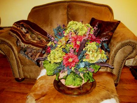 This silk arrangement creates a softer feel to a rustic room.