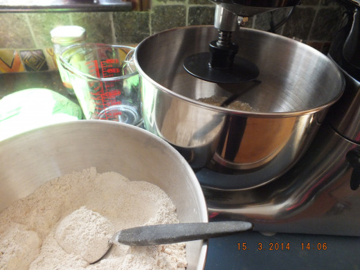 Start the mixing on the lowest setting and start adding flour, a cup at a time. 