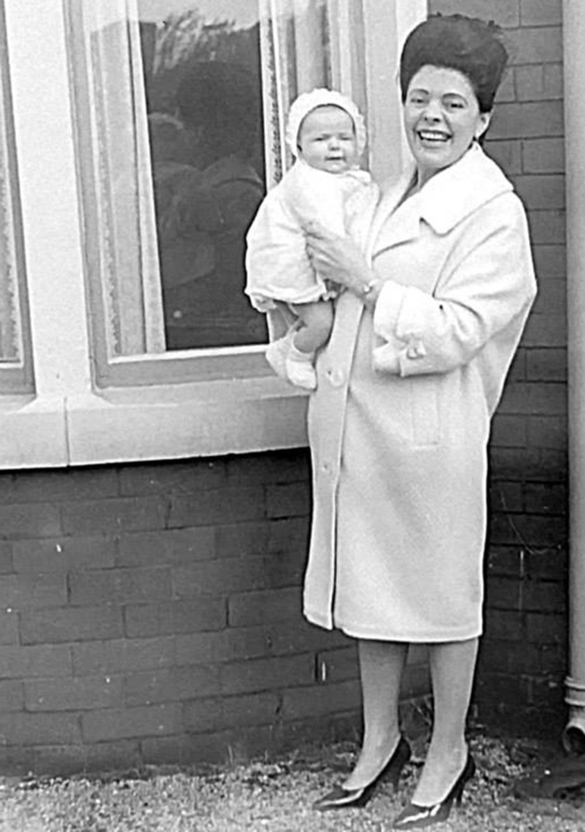 Me as a baby with my Auntie Josie, dad's sister, who lived nearby, pictured in the front garden. She was the height of fashion with her winkle-picker shoes and beehive hair do.