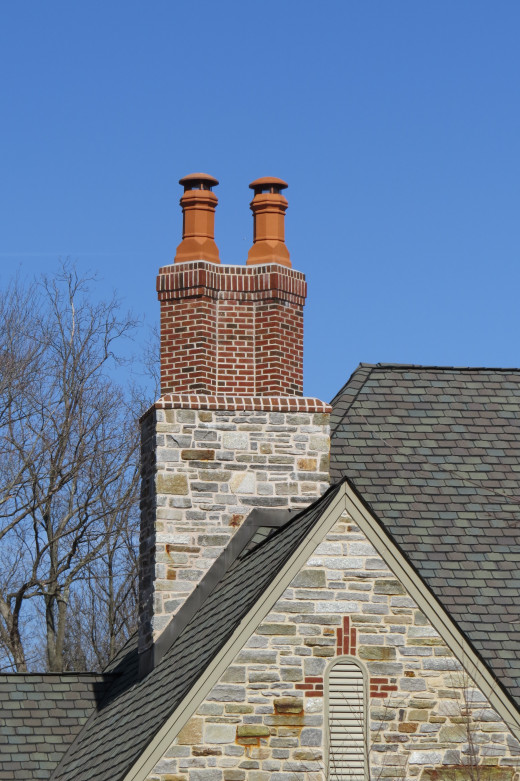 Twin chimney pots atop a double chimney.