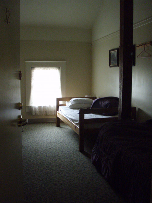 My room in a youth hostel that was once used as a cremation parlor and funeral home.  I went downstairs, to where none of the rooms were occupied, but heard a door open.  Maybe the setting for the next horror film?    