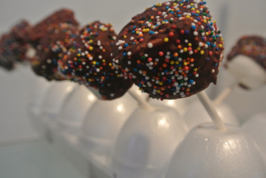 Make party treats like marshmallow pops that are easy and cheap.  They are easy enough to let the kids at the party do this as an activity. They can then take some home as party favors instead of preparing goody bags.