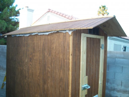 After T1-11 siding is installed but before corner trim is added and the roof plastic gets a final cut.