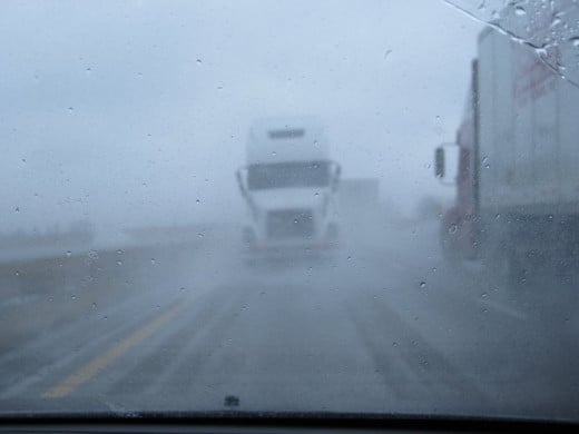 Visibility was poor, as you can see, when I saw THIS coming at me [I thought] down the highway. It was actually being towed by another truck. Way to scare drivers behind you half to death! 
