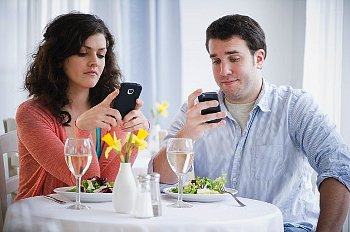 Talking with girlfriends, or another guy, while having dinner with her date