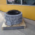 Showcasing the complete fire pit enclosure with samples of two paver sizes (in front).