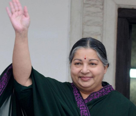 Jayalalitha is waving her hand to the AIADMK supporters.