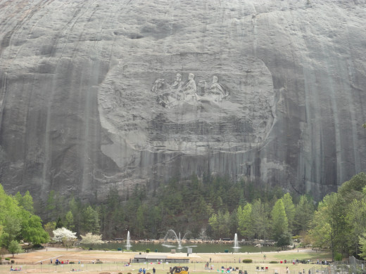 The carved surface measures 3 acres and is larger than a football field and Mt. Rushmore.