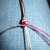 Tighten the first half against the over hand knot.