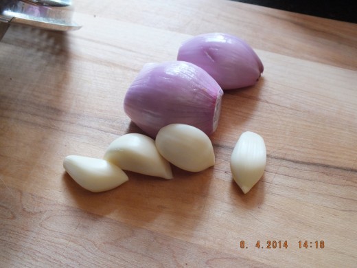 I am ready to chop the garlic and shallots. Just rough chop because you are going to break it down further in the food processor.