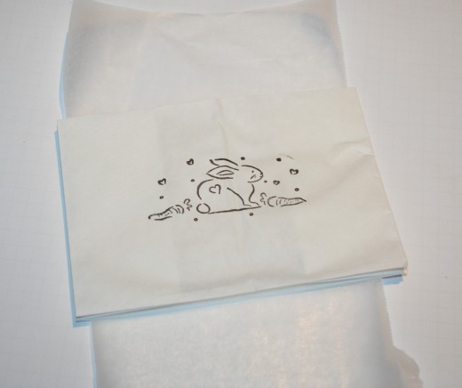 Protect the color from going through to the back with a sheet of wax paper placed in between.
