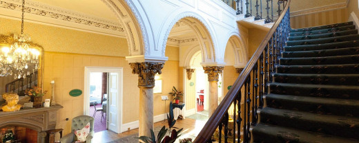 Inside hotel, showing hallway & staircase.