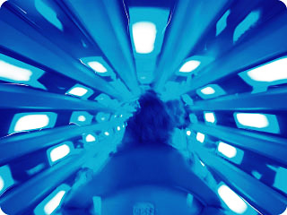 A rider's eye view from within the neon Launch Tube inside Magic Kingdom's Space Mountain.