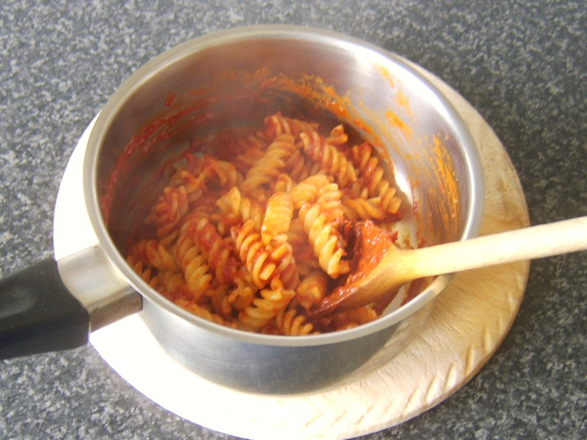 Fusilli pasta is folded through sweet pepper and tomato sauce