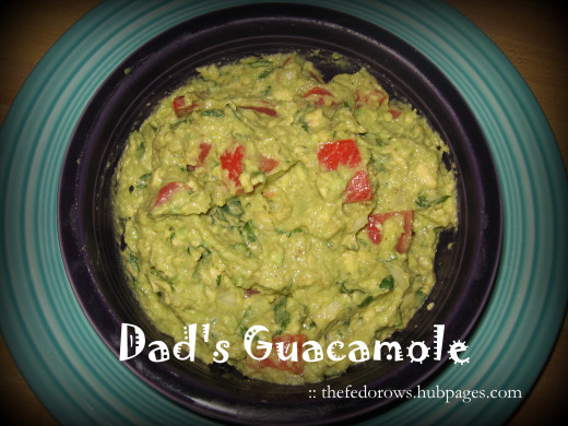 My Dad's guacamole is packed with flavor!  Avocados are mashed with lime, cumin, cayenne, salt, garlic, tomatoes, onion, and cilantro.  Yum!