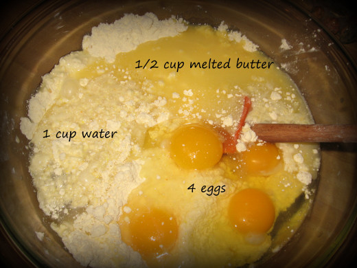 3. Add the wet ingredients (eggs, melted butter, water) into the dry.  