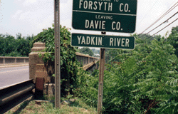 The Yadkin River sign in Davie County, North Carolina. Photo Image taken by the author on a July 2000 visit to the area.
