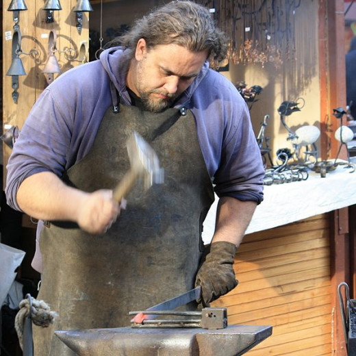 A blacksmith plying his trade