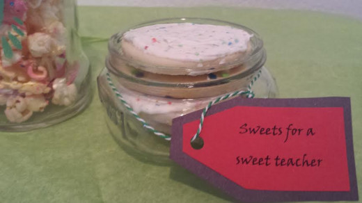 Bake up some sweets if it's not against school policy to give as teacher gifts.  You can buy store-bought treats, too or just put ingredients to the recipe and attach directions on how to bake it.  Add tag with sweet message!