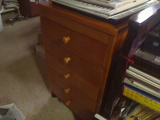 Americana Taboret next to my laptop cart, with drawer knobs and casters added. It rolls so easy on carpet, it's great!
