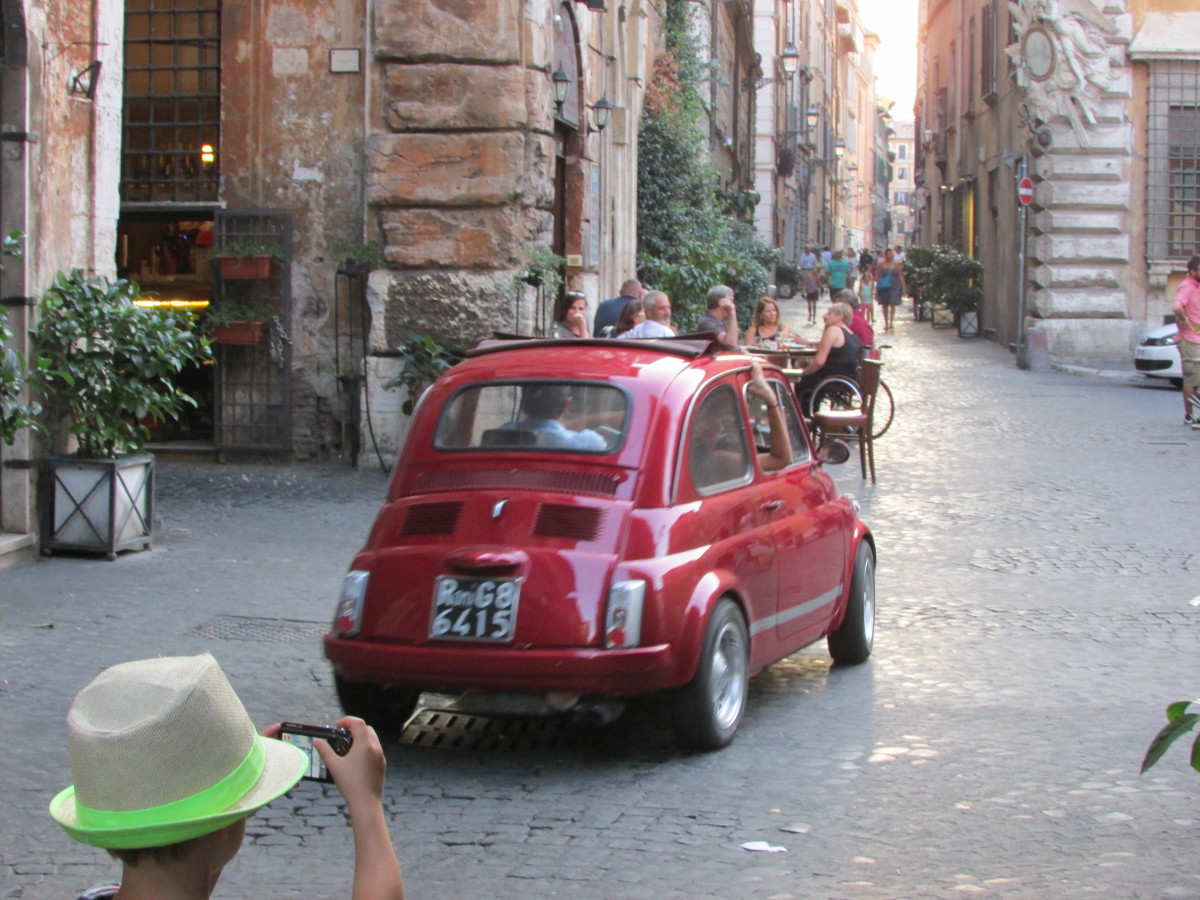 Our son photographs a car in Navona