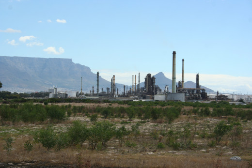 Chevron Oil Refinery (previously known as the Caltex Refinery) in Cape Town, South Africa. Table Mountain is pictured in the distant background.