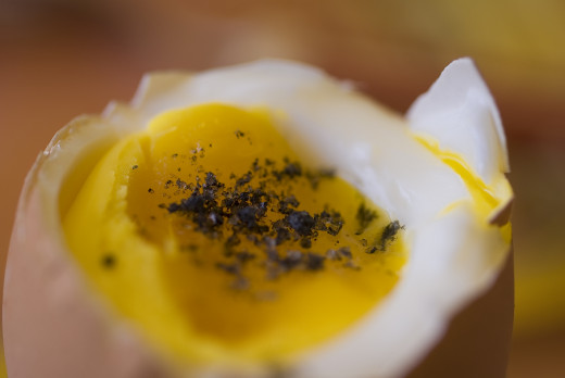 Soft boiled egg with black lava salt from Hawaii