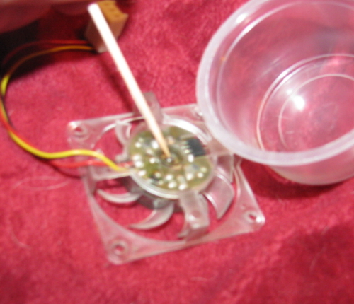 I dabbed the oil onto the end of the bearing shaft using the tip of the toothpick. This would probably have worked better using a plastic toothpick... Reapeat this step as necessary, making sure to work the oil in by rotating the fan manually. I dabbed the oil onto the end of the bearing shaft using the tip of the toothpick. This would probably have worked better using a plastic toothpick... Reapeat this step as necessary, making sure to work the oil in by rotating the fan manually.